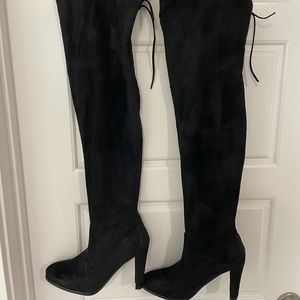 Knee high black heeled boots